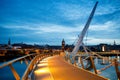 Derry, Ireland. Illuminated Peace bridge in Derry Londonderry, City of Culture, in Northern Ireland with city center at