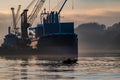 Derry, Londonderry, United Kingdom - December 19 2021: Staff working on the river foyle harbour in Northern Ireland Royalty Free Stock Photo