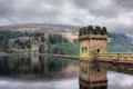 Derwent reservoir stone dam breakwater under a cloudy sky Royalty Free Stock Photo