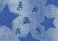 Denim Fabric with Embroidered Letters and Stars Royalty Free Stock Photo