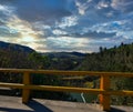 Descendant sun behind a valley