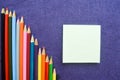 A descending chart of colorful, bright, variegated drawing pencils, a notebook Royalty Free Stock Photo