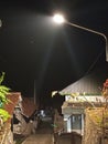 descending roads and street lights in Indonesian mountain villages