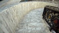 Descent along the marble spiral staircase. First person view Royalty Free Stock Photo