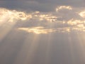 Descent of Divine Blessings from Sky - Sun Rays through Clouds Royalty Free Stock Photo