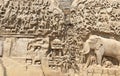 Bas relief rock cut sculptures of Gods, people and animals carved in monolithic rock Royalty Free Stock Photo