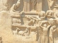 Bas relief rock cut sculptures of Gods, people and animals carved in monolithic rock Royalty Free Stock Photo