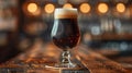Close-up of a pint of stout beer on a wooden table Royalty Free Stock Photo