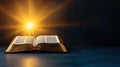 Illuminated open Bible with light rays and smoke on dark background Royalty Free Stock Photo