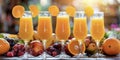 Orange juice in a glass glass, fruits and berries in the background. Royalty Free Stock Photo