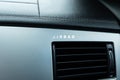Inscription on the panel of the vehicle airbag. background of grey textured plastic close-up