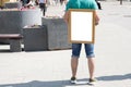 man holding a blank white board on his back Royalty Free Stock Photo