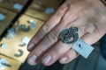 Armenia, Yerevan, September 2021. Silver ring with Armenian symbols on a woman`s hand.