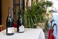 Desenzano del Garda, Italy - September 21, 2021: Elegant wine bottles at the entrance of Italian restaurants used as a tourist