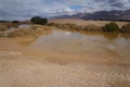 Desert Arava with puddles after rain Royalty Free Stock Photo