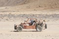 Desert buggy racing across ground Royalty Free Stock Photo