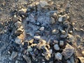 Desert camp fire with rocks in the evening as the sun sets Royalty Free Stock Photo