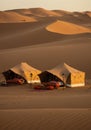 Desert Camp Tents at Sunrise in Sand Dunes Royalty Free Stock Photo