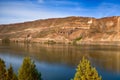 Desert cliffs reflect in Lake Billy Chinook