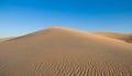 Desert concept, sand dune and blue sky Royalty Free Stock Photo