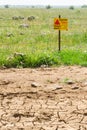 Desert dried land and quiet green mines field Royalty Free Stock Photo