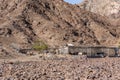 Desert farm with animal enclosures in Hajar Mountains in United Arab Emirates (Masafi village) with goats. Royalty Free Stock Photo