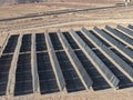 Desert fields filled with solar panels with solar tracking to maximize electricity generation Royalty Free Stock Photo