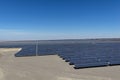 Desert fields filled with solar panels with solar tracking to maximize electricity generation Royalty Free Stock Photo