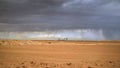 the desert is filled with dirt and storm clouds overhead it Royalty Free Stock Photo