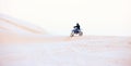 Desert, hill or athlete driving motorcycle for action, adventure or fitness with performance or adrenaline. Sand, sports Royalty Free Stock Photo