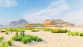 Desert horizon. Clear day. Mountains in the distance, sand dunes and blue sky. Beautiful scenery. Sand dunes and hot sky Royalty Free Stock Photo