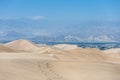 Desert in Huacachina, Peru. Buggy road and Mountain in background