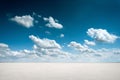 Desert landscape with deep blue sky and clouds