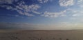 desert landscape. an artificial desert after the enrichment of sands by a metallurgical plant. Sand to the horizon. Blue Royalty Free Stock Photo