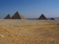 Desert Landscape Giza Pyramids with Cairo City in Distanc Royalty Free Stock Photo