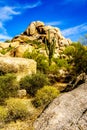 Desert Landscape and Large Rock Formations with Saguaro Cacti Royalty Free Stock Photo