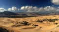 Panoramic Desert Landscape with Sand Dunes and Mountains Royalty Free Stock Photo