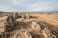 Desert landscape with rock formations of sharp rocks and dry land Royalty Free Stock Photo