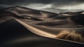 a desert landscape with a storm moving in the distance and a single tree in the foreground, with mountains in the distance, and a Royalty Free Stock Photo