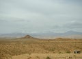 Desert landscapes in Morocco, desolate lands with paths that lead to remote and unexplored corners Royalty Free Stock Photo