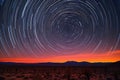 desert night sky with star trails around north star