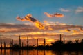 Desert Oasis at Sunset with clouds and orange colored sky Royalty Free Stock Photo