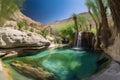 desert oasis with waterfalls and rock pools on a mountainside