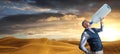 Desert panorama of the dunes at sunset with man drinking Royalty Free Stock Photo