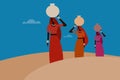 Women carrying water pots on their heads in the desert Royalty Free Stock Photo