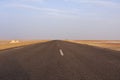 Desert road, dry salt lake Chott el Djerid in Tunisia Royalty Free Stock Photo