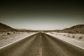 Desert road highway in death valley national park Royalty Free Stock Photo