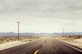 Desert Road With Telephone Poles Royalty Free Stock Photo