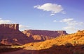 Desert Road Through Rocky Mesas at Sunset Royalty Free Stock Photo