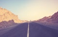 Desert road at sunset, color toning applied, Egypt Royalty Free Stock Photo